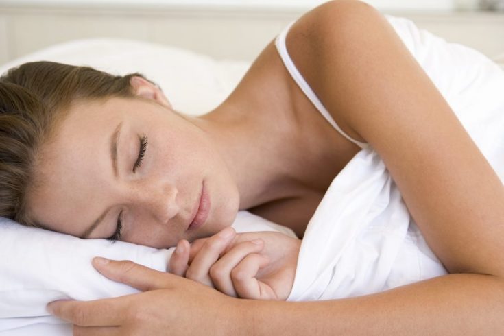 woman lying in bed sleeping