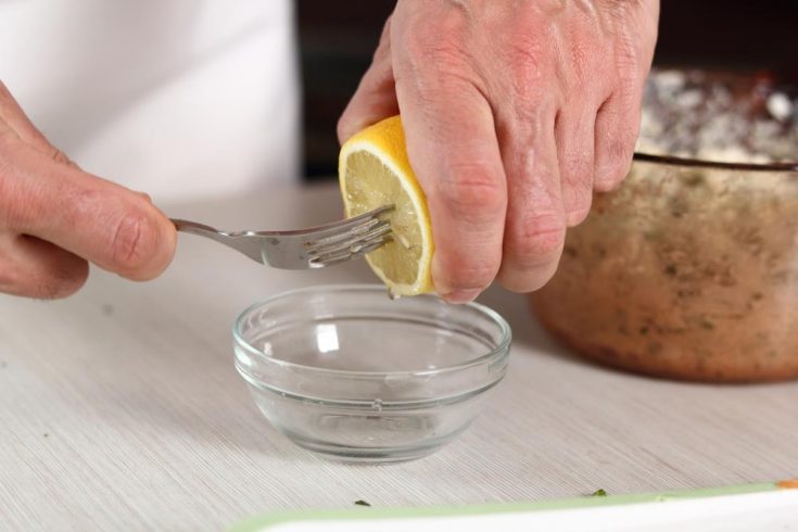 Squeeze a lemon with fork